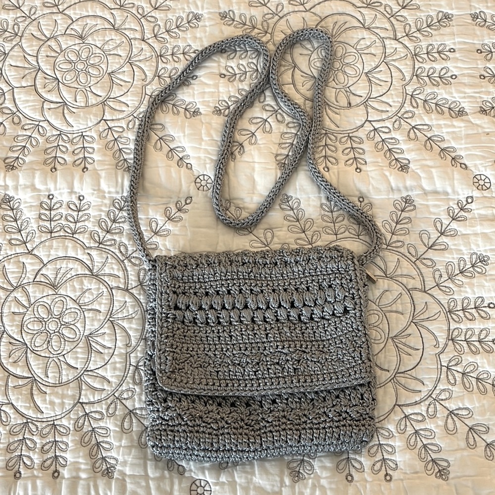 The Sak gray with silver metallic threads crossbody. 7”x6”.
